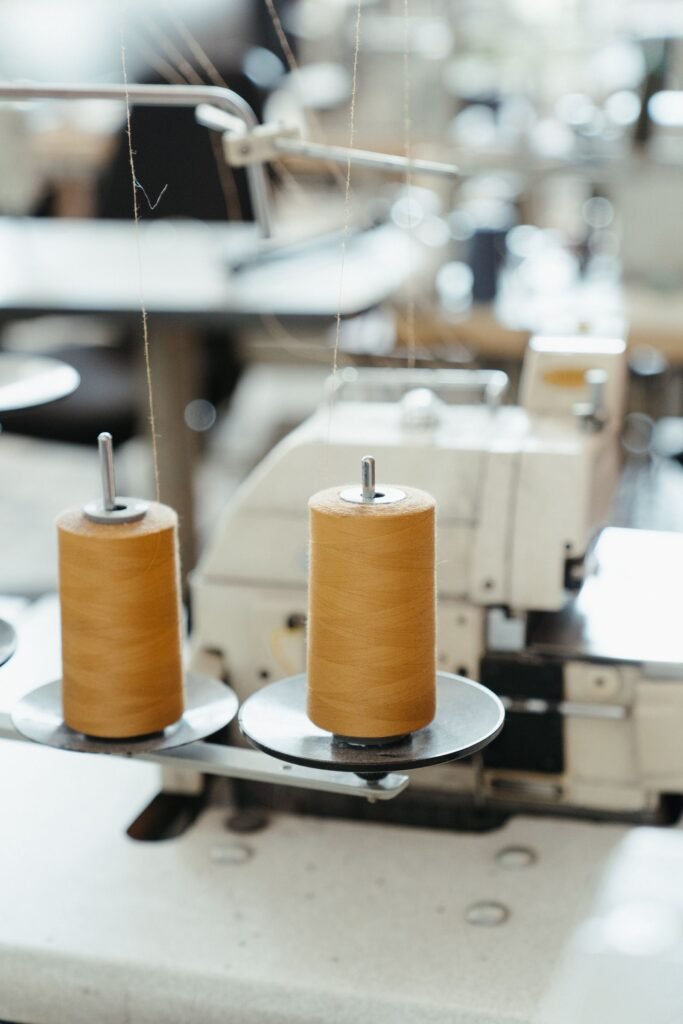 Industrial sewing machine with thread cones
